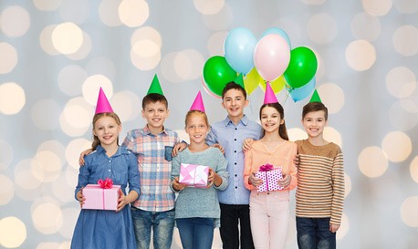 happy children with gifts on birthday party